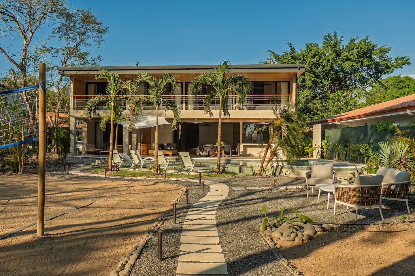 Stepping-stone path on gravel with river stone borders, Villa Viva landscape